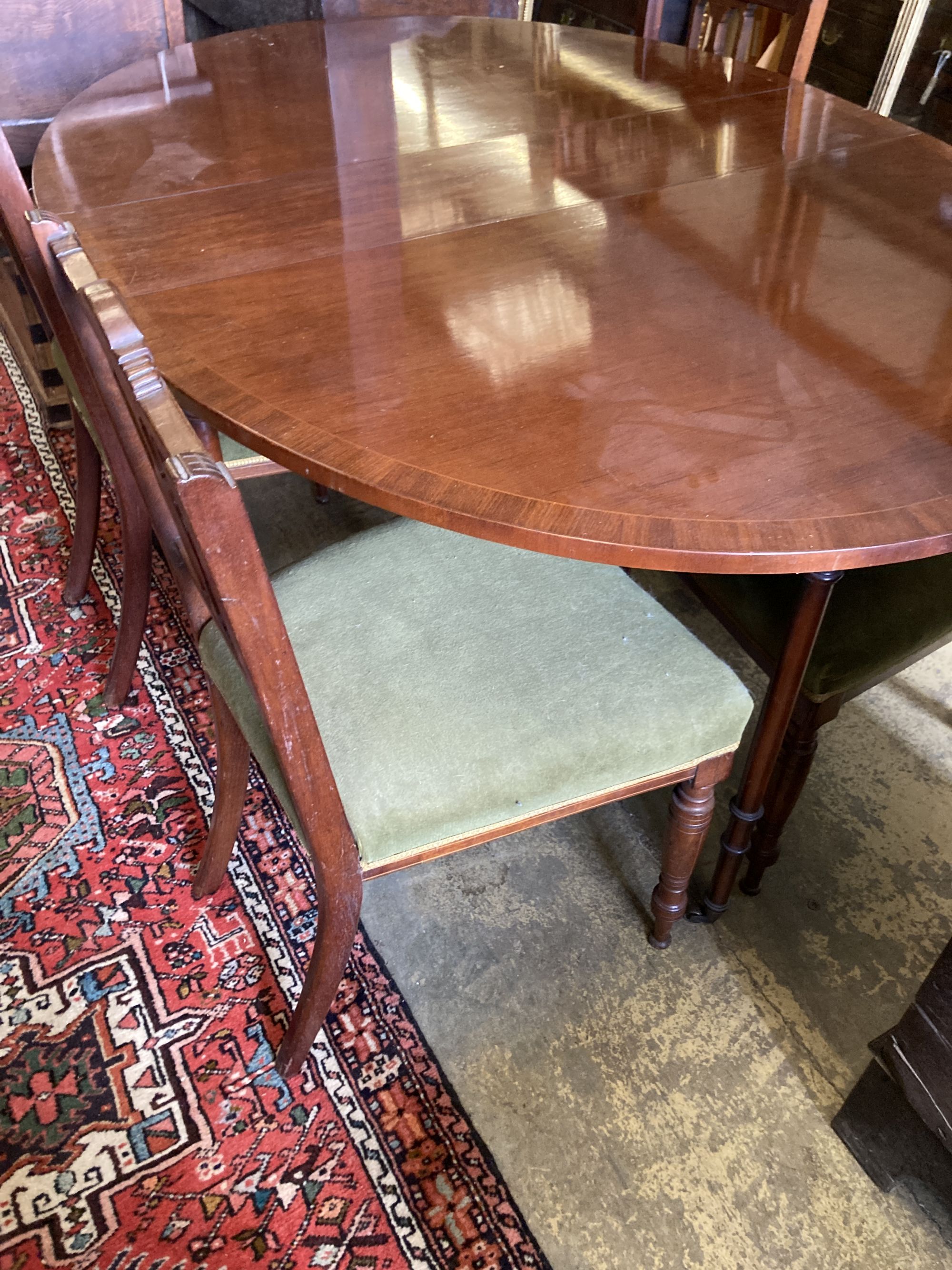 A Victorian style banded mahogany drop flap dining table, 138cm extended together with a set of four Edwardian inlaid mahogany dining c